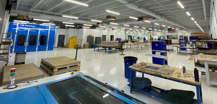 Workstations and paint booth at the new facility