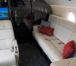 The overall design of this Falcon 900EX EASy, recently refurbished by Duncan Aviation, is clean and masculine with a lot of leather and dark, heavily grained veneer, mixed with textures to help soften the overall space