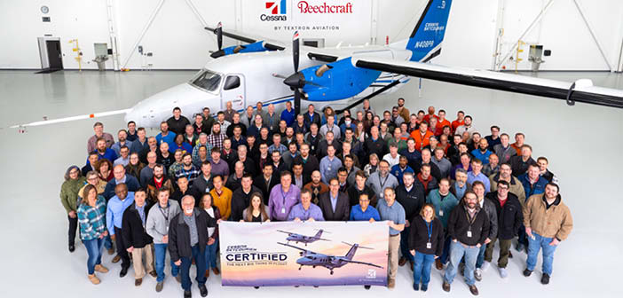 Representatives from the FAA and Textron Aviation stand in front of the Cessna SkyCourier as they celebrate the aircraft’s certification