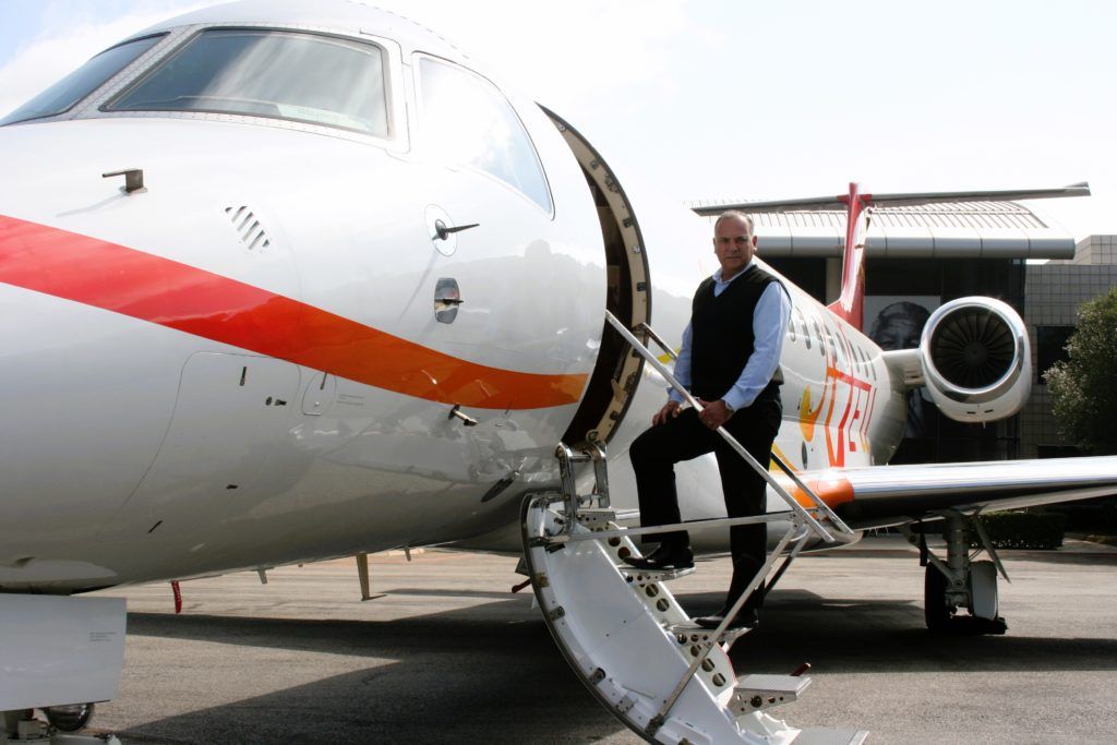 Vince Goncalves, regional vice president, Africa, at ExecuJet MRO Services, boarding an Embraer Legacy business jet
