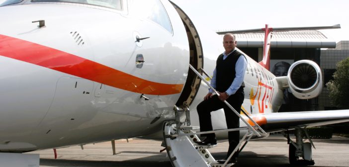 Vince Goncalves, regional vice president, Africa, at ExecuJet MRO Services, boarding an Embraer Legacy business jet