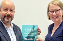 Elina Kopola, founder of the Green Cabin Alliance, presenting the members' plaque to Richard D’Cruze, business development director at JPA Design