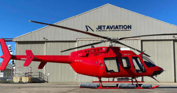 A red Bell 407GXi helicopter delivered to Nautilus Aviation, pictured outside a Jet Aviation hangar