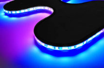 The Curve flex light displayed with blue and pink sections, bending around curves