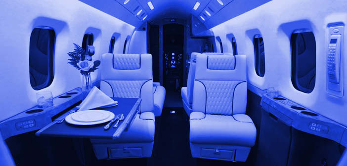 Business aircraft interior with blue mood lighting