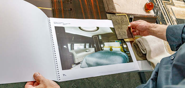 Close up of a design on paper with material samples alongside
