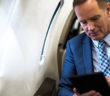 Man using tablet in business jet