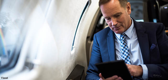 Man using tablet in business jet