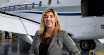 Meghan Knott in front of aircraft