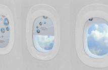 three aircraft windows with shades fully, partially and completely drawn